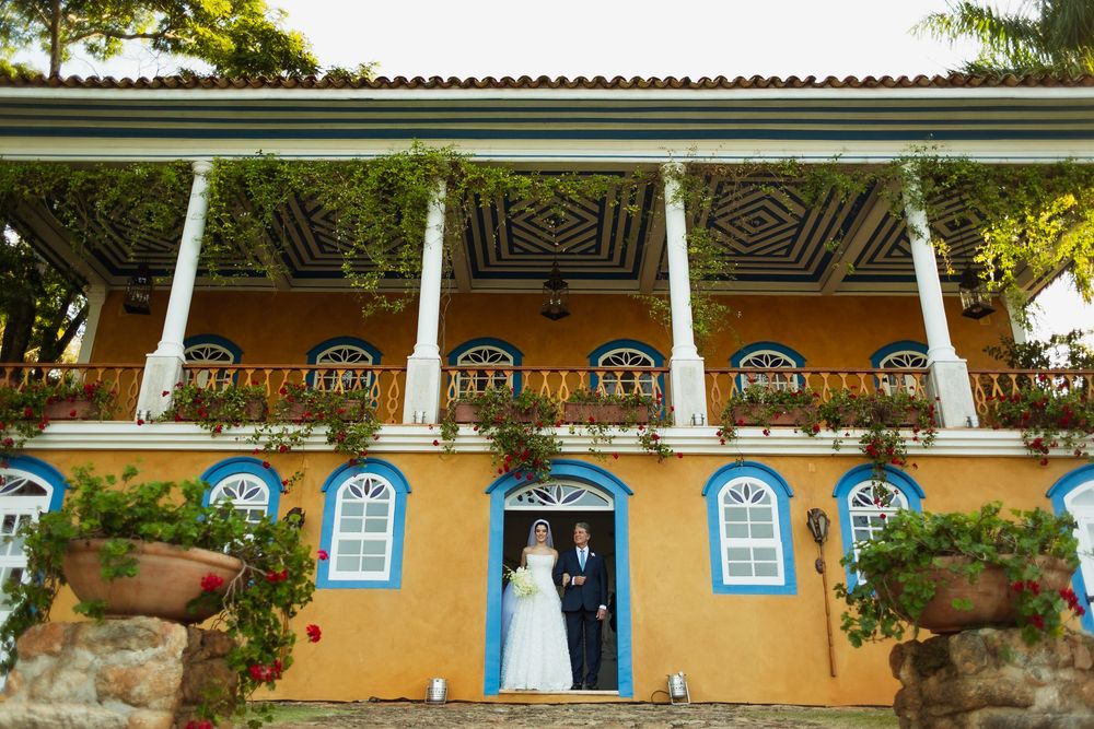 Yellow colonial-style building with ornate white trim and traditional Portuguese architectural details.