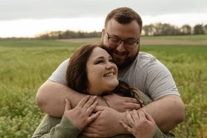 An intimate moment captured between a couple in an outdoor setting.