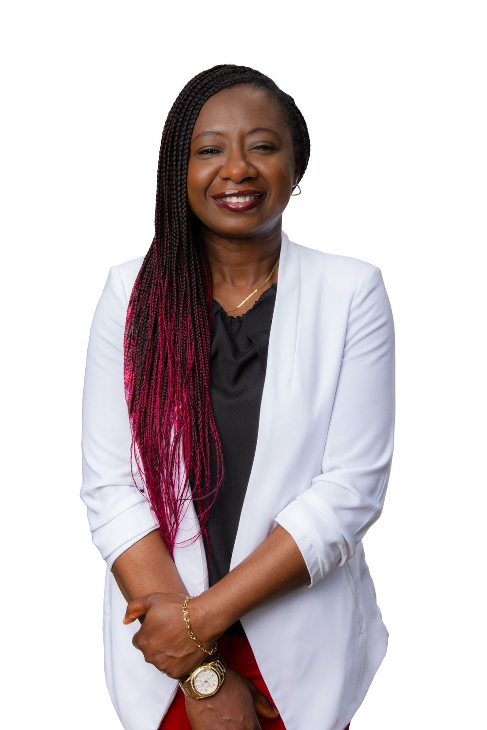 Professional portrait of someone wearing a crisp white blazer over black top, with ombre burgundy braided hair.