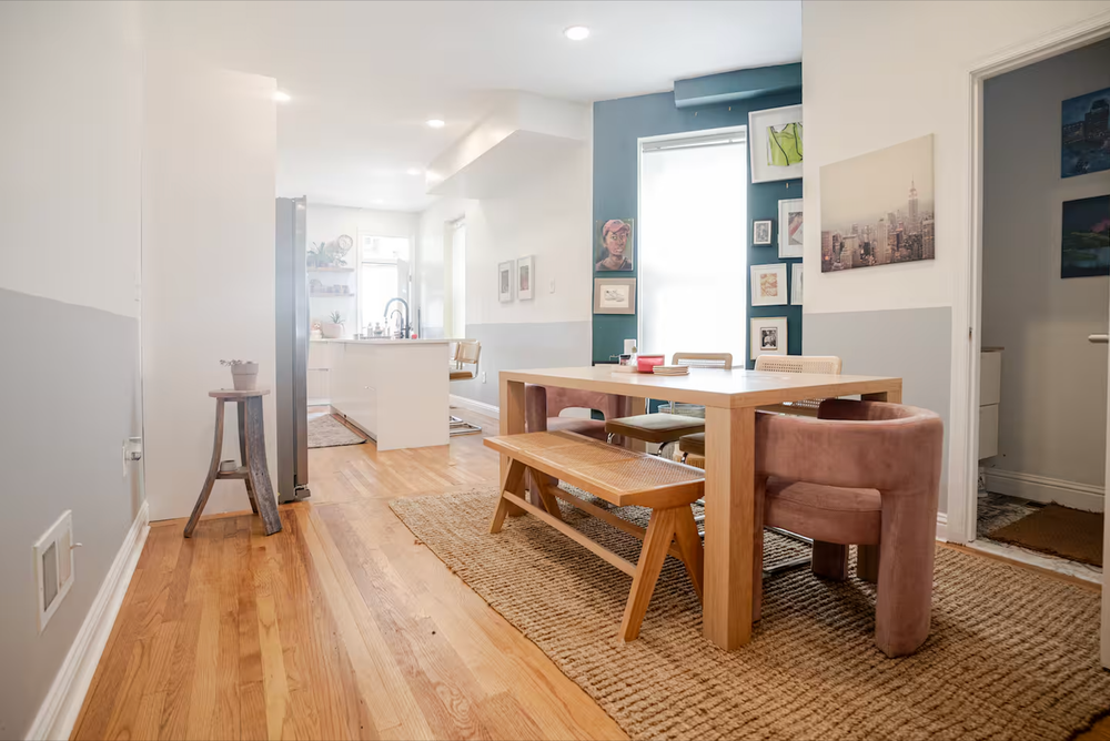 Detail shot of handmade wooden table in sunlit Baltimore rowhome kitchen. Interior photography.