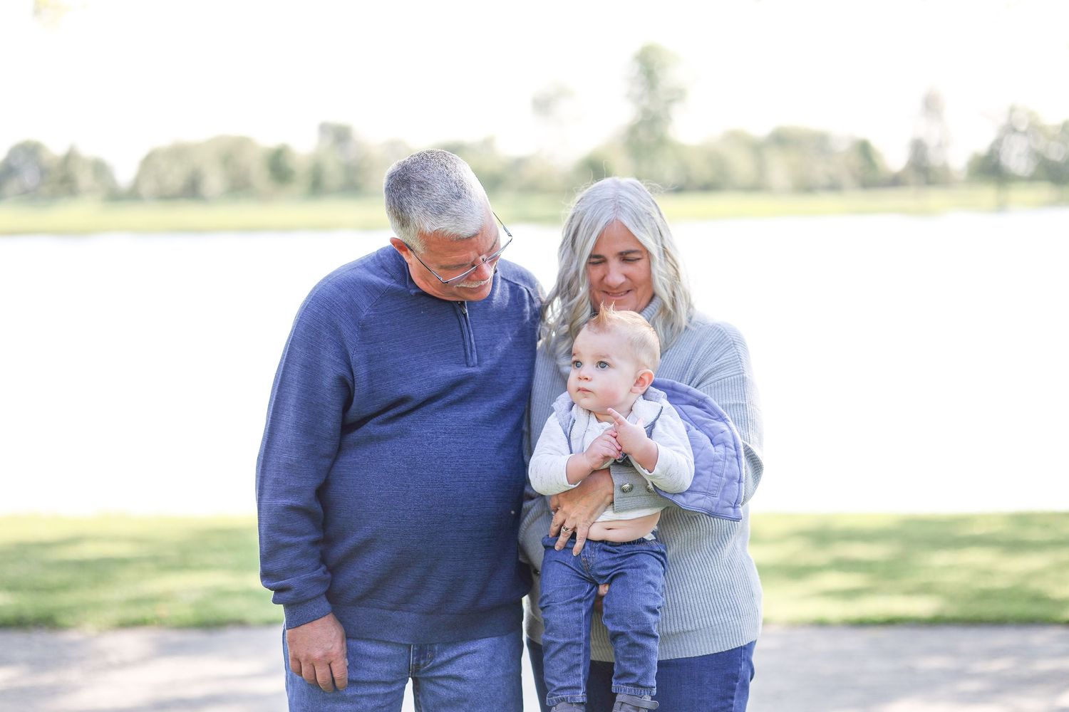 Springfield, IL family photographer captures grandparents with their grandson during a photo session in Central, IL