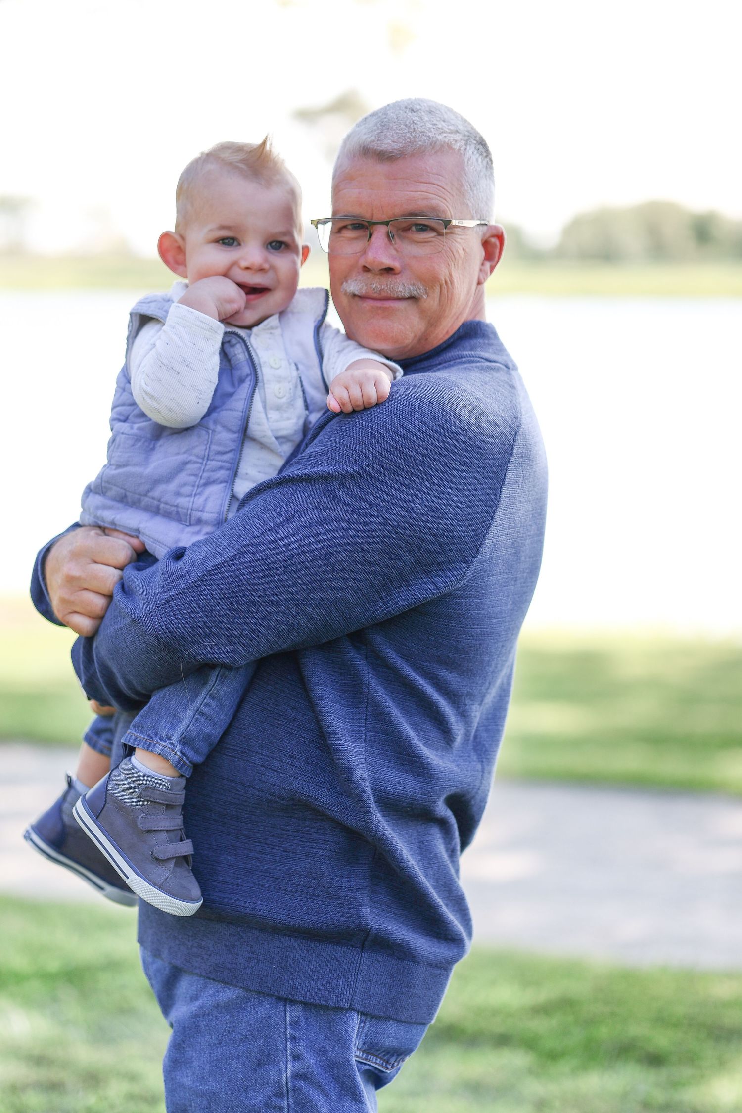 Springfield, IL family photographer captures a grandfather and grandson together during a photo session in Central, IL
