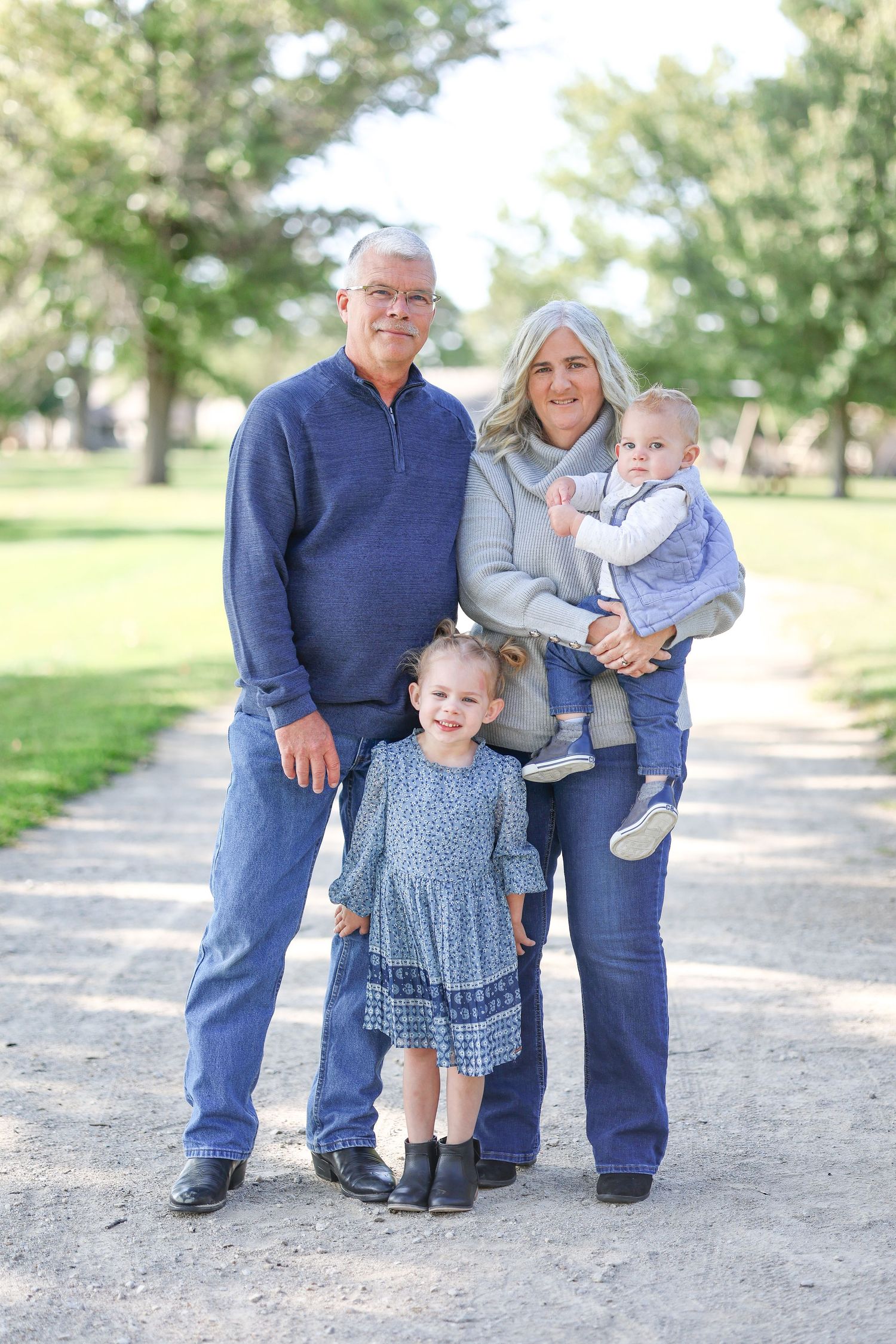 Springfield, IL family photographer captures grandparents with their two grandkids during a photo session in Central, IL
