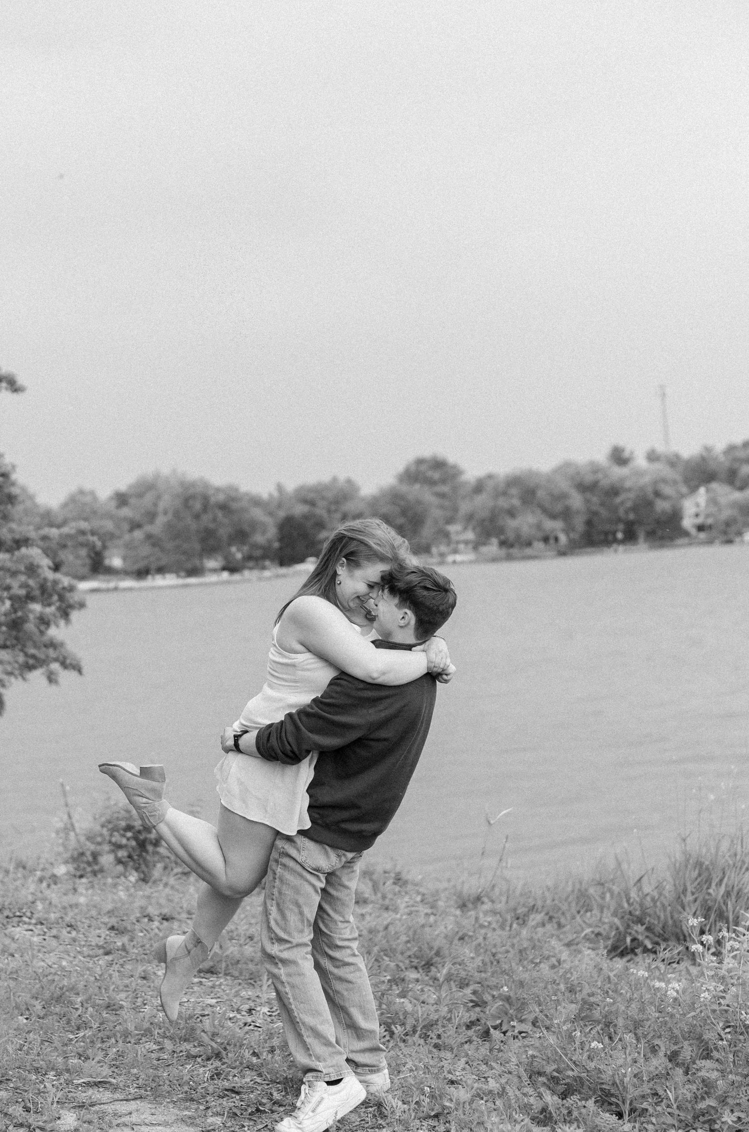 Outdoor summer engagement photos at the lake in Bloomington, Illinois