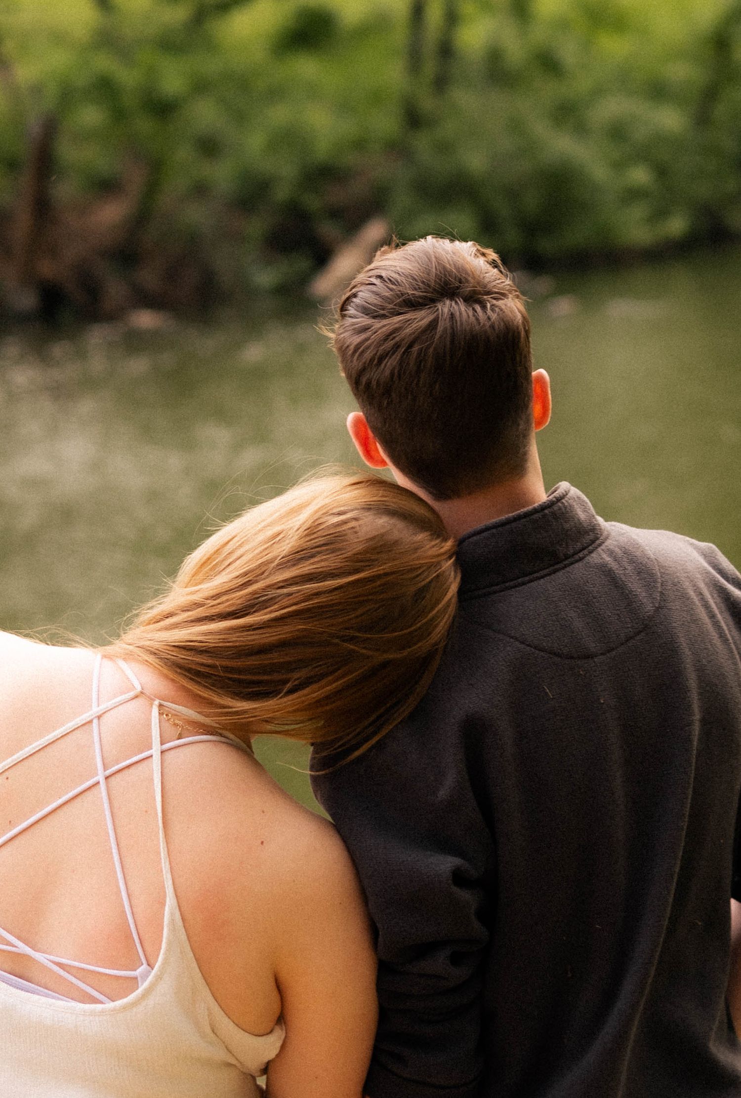 Outdoor summer engagement photos at the lake in Bloomington, Illinois