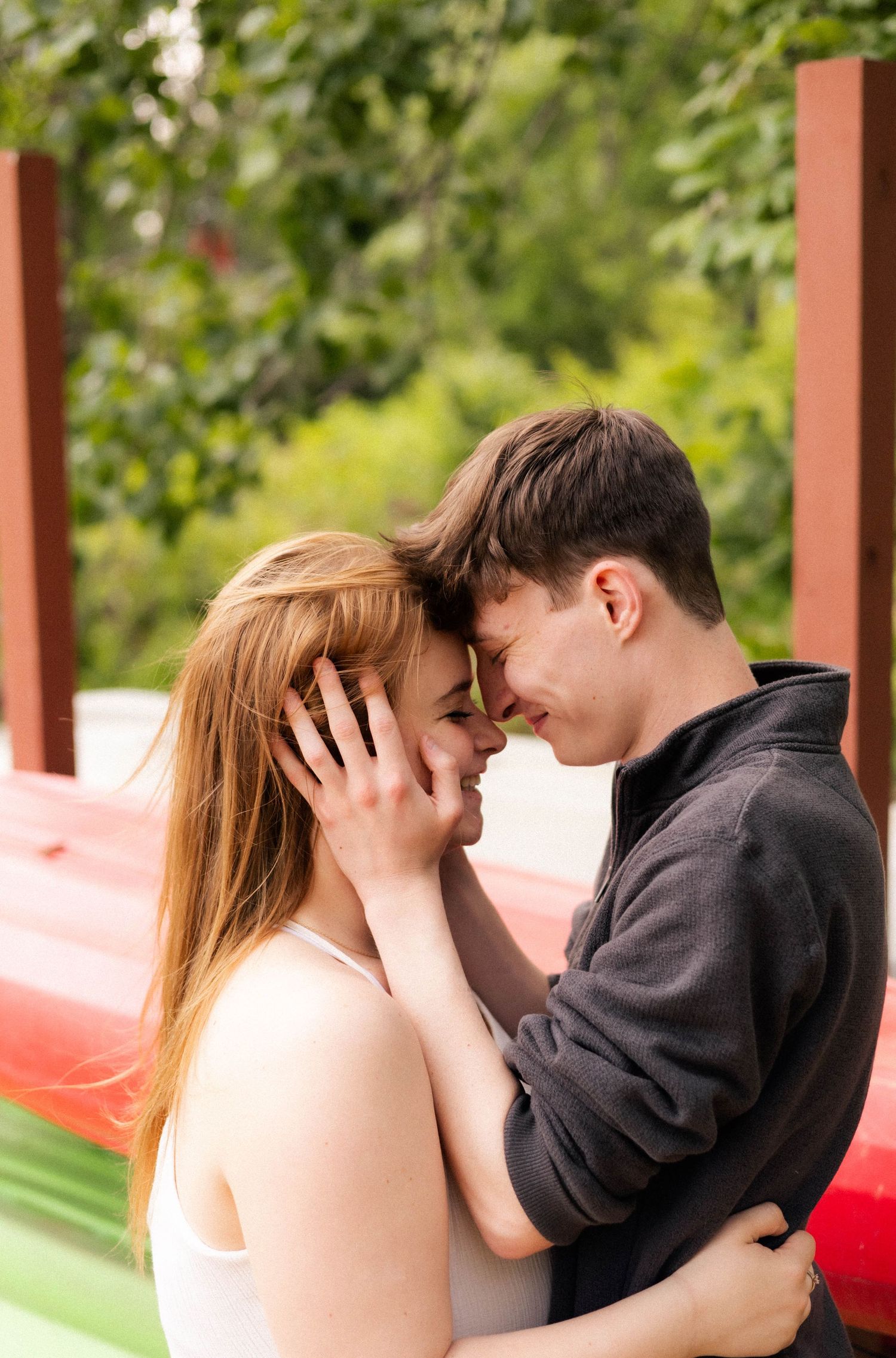 Outdoor summer engagement photos at the lake in Bloomington, Illinois