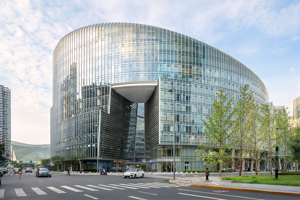Architectural photography of contemporary glass office building in downtown