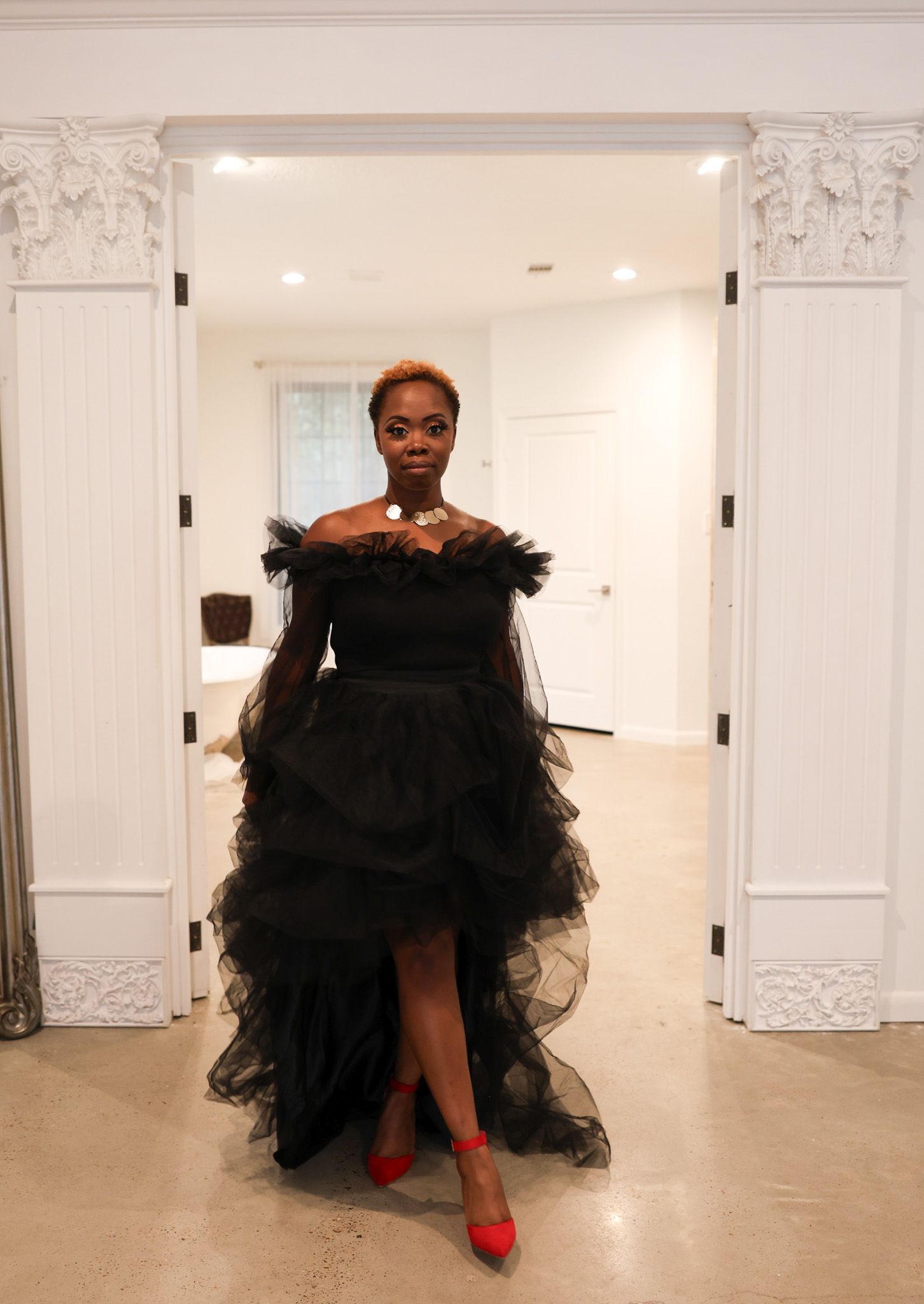 Fancy black chiffon dress for engagement photo session in Houston, TX studio