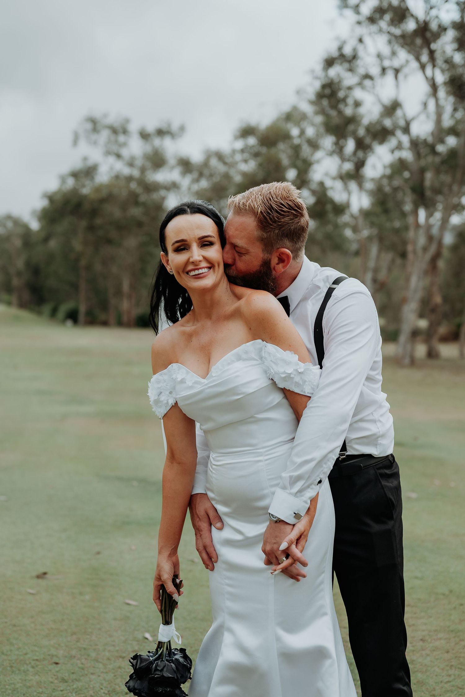 Candid wedding moment captured on 1770 golf course with joyful couple in white dress and formal wear.