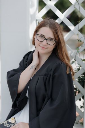 Professional portrait session against white lattice backdrop.