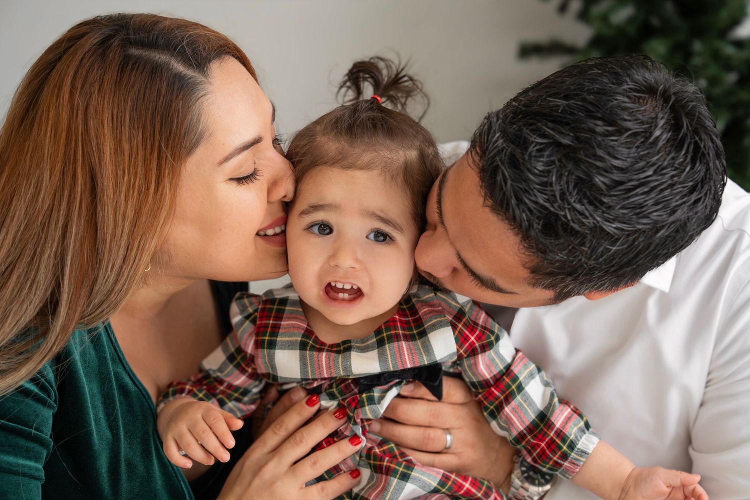 A family shares joyful moments together in a series of candid lifestyle photos with plaid clothing.