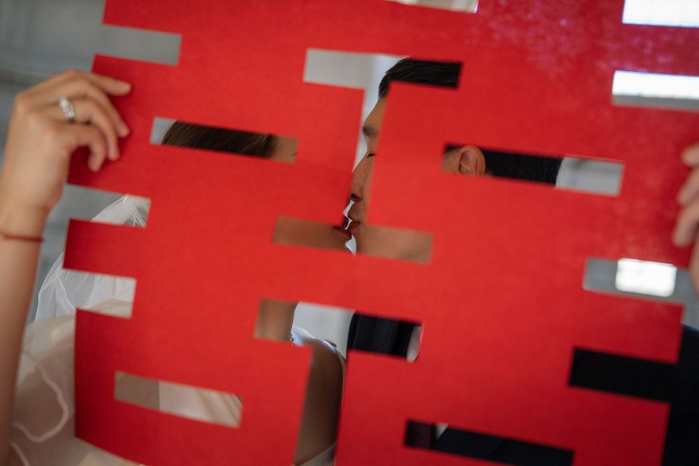 Red and white geometric pattern creates an abstract background design with repeating rectangular shapes.