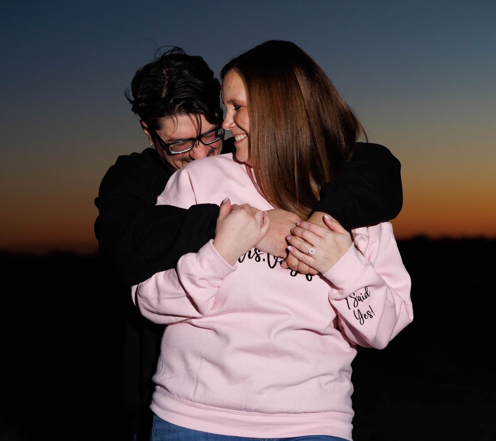 A series of intimate embraces captured against a dark sunset sky.