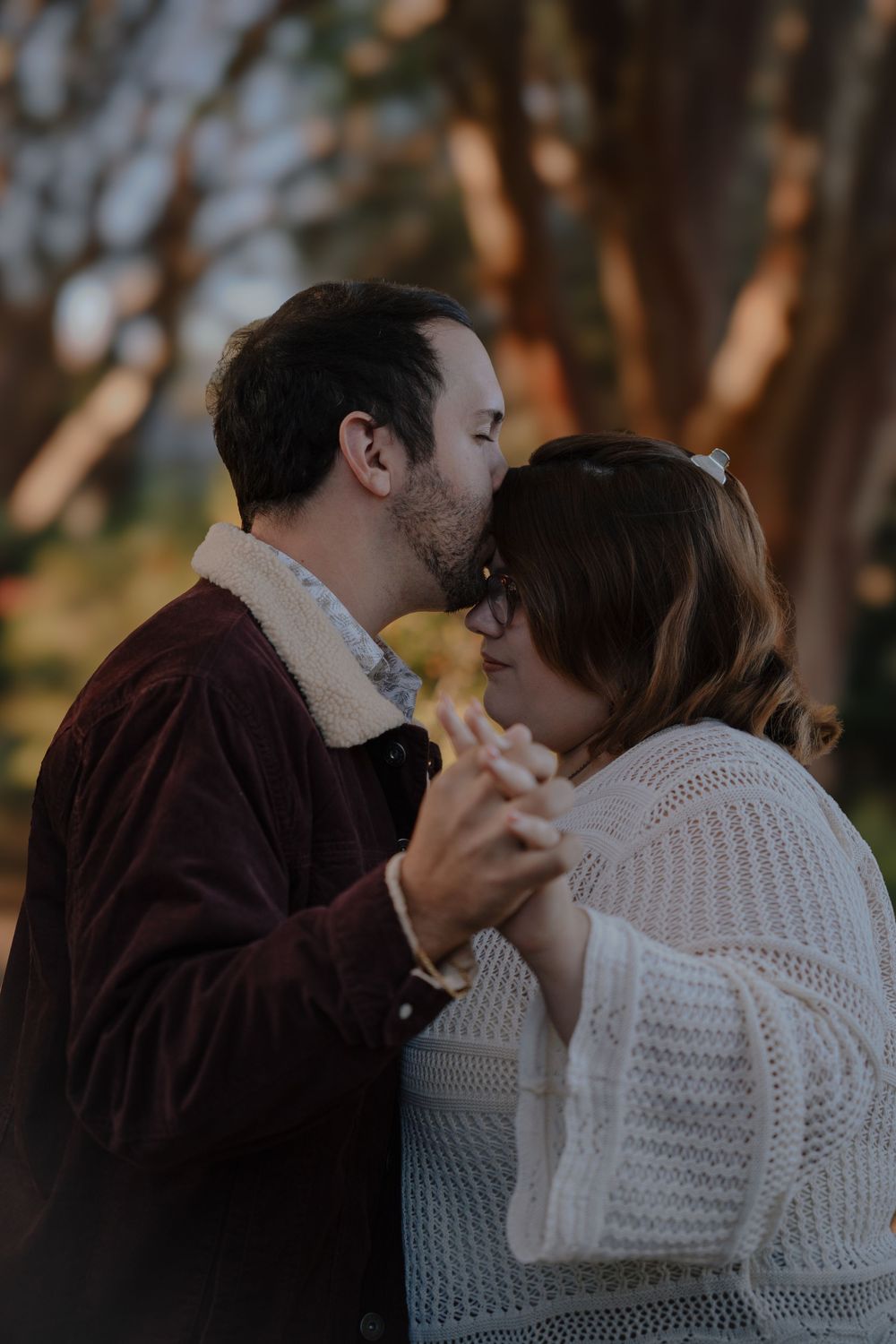 A romantic couple shares intimate moments in a series of progressive photos outdoors.