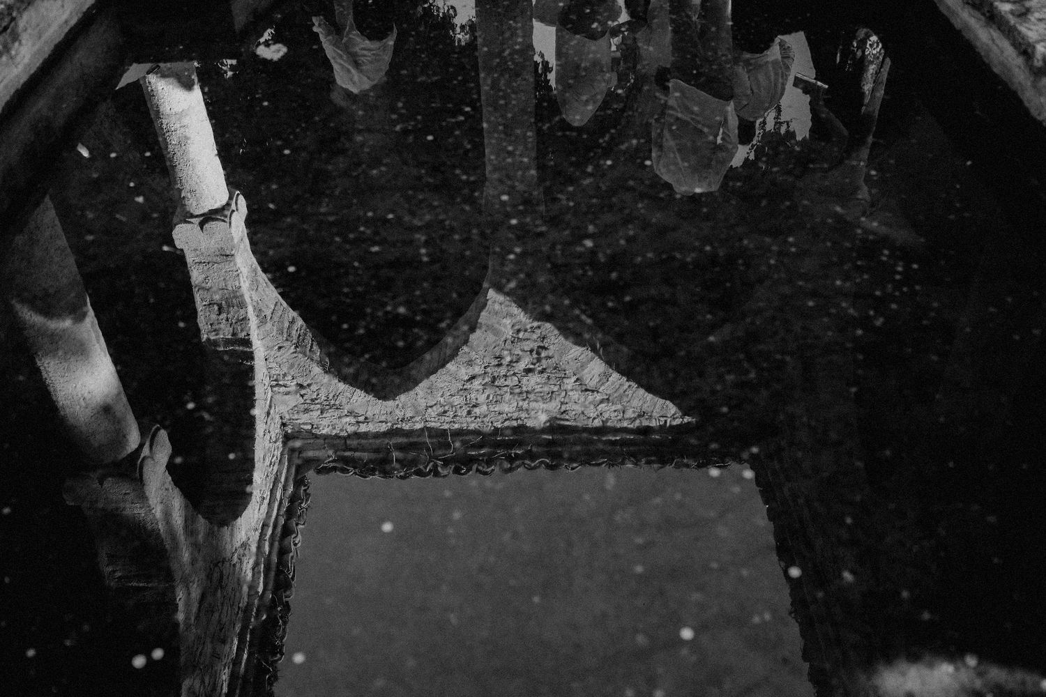 High contrast black and white architectural detail showing a geometric pattern and shadows.