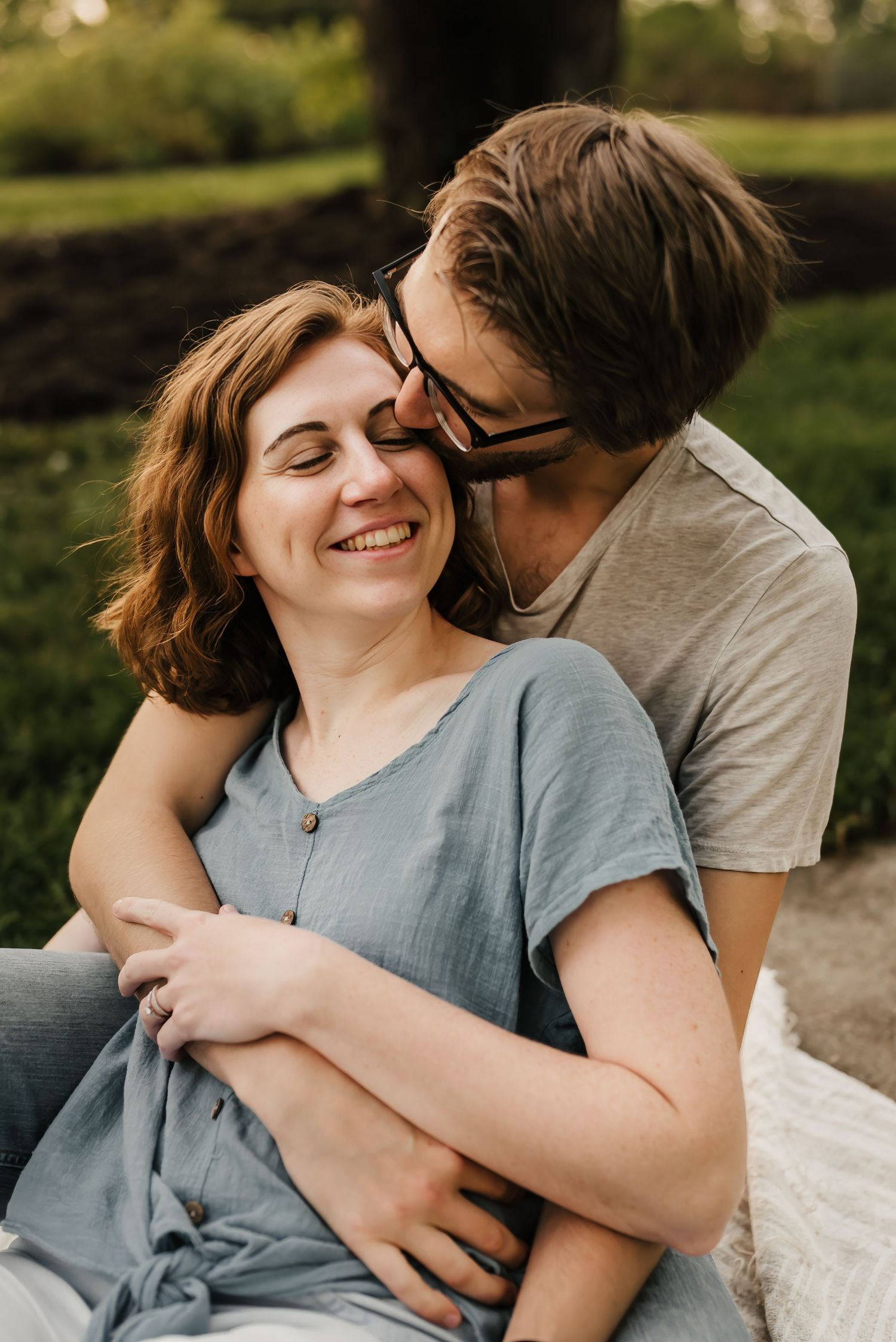Husband adores wife at their photo session