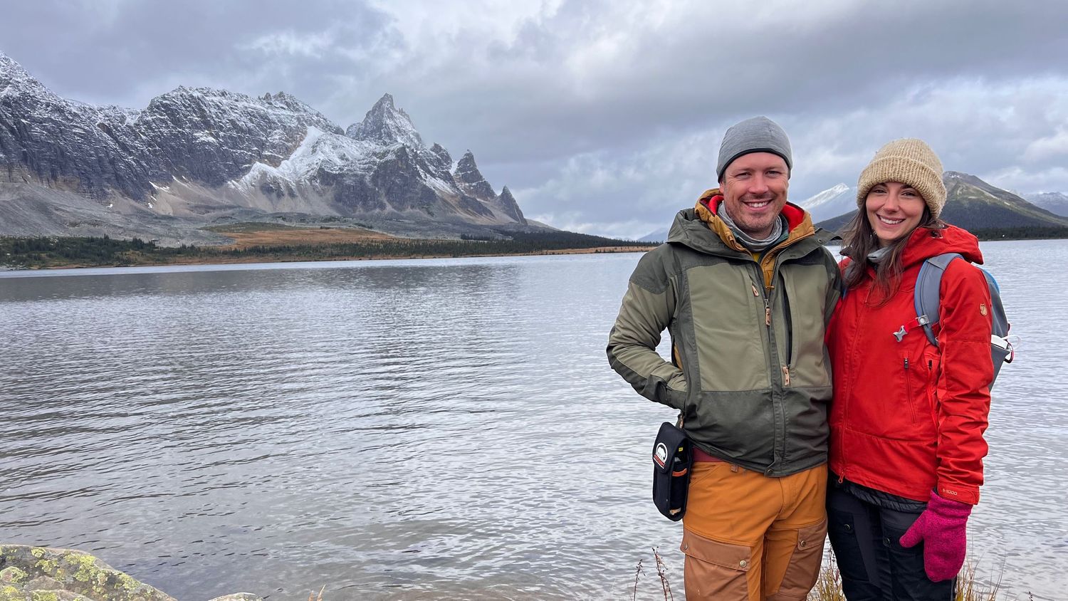 Scenic mountain lake view in winter with snow-capped peaks and cloudy skies at Jasper National Park. Evan Will and Kristen Lusk