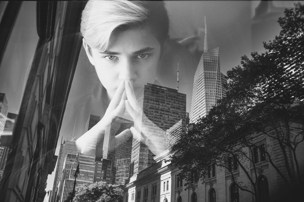 Conceptual fine art portrait with urban double exposure in black and white