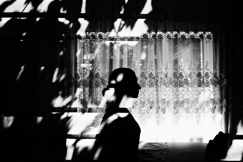 Cinematic black and white fine art photograph with light and shadow