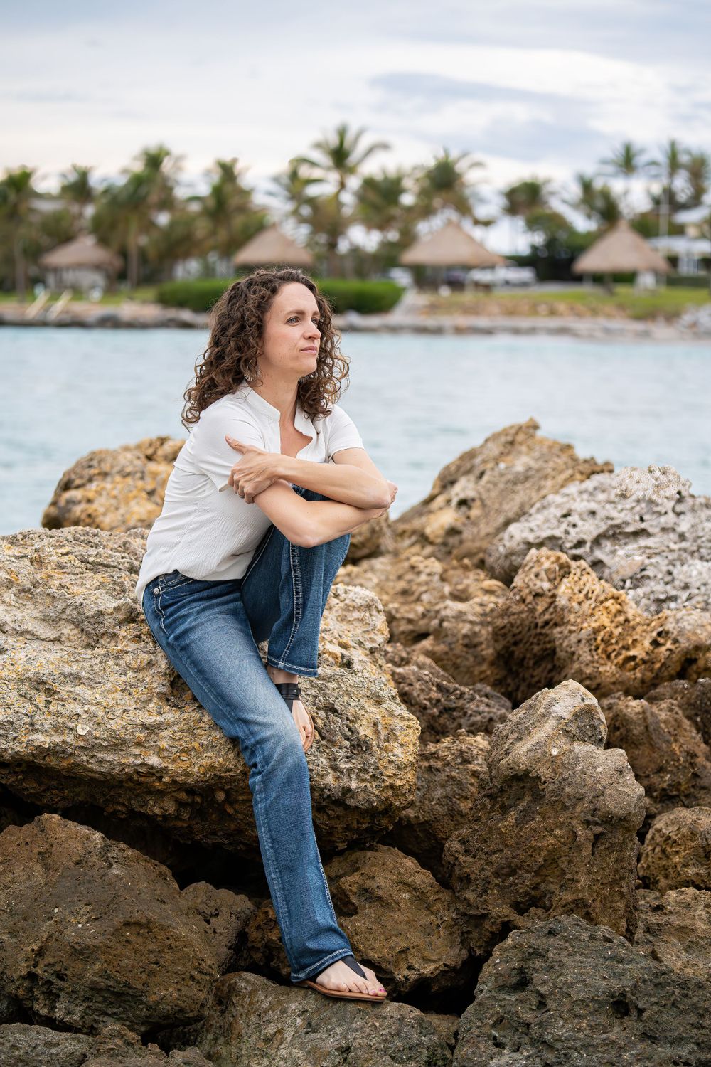 My sister, Casey, gazing off into the distance while sitting on the rocks in Dubois Park in Jupiter, Florida.