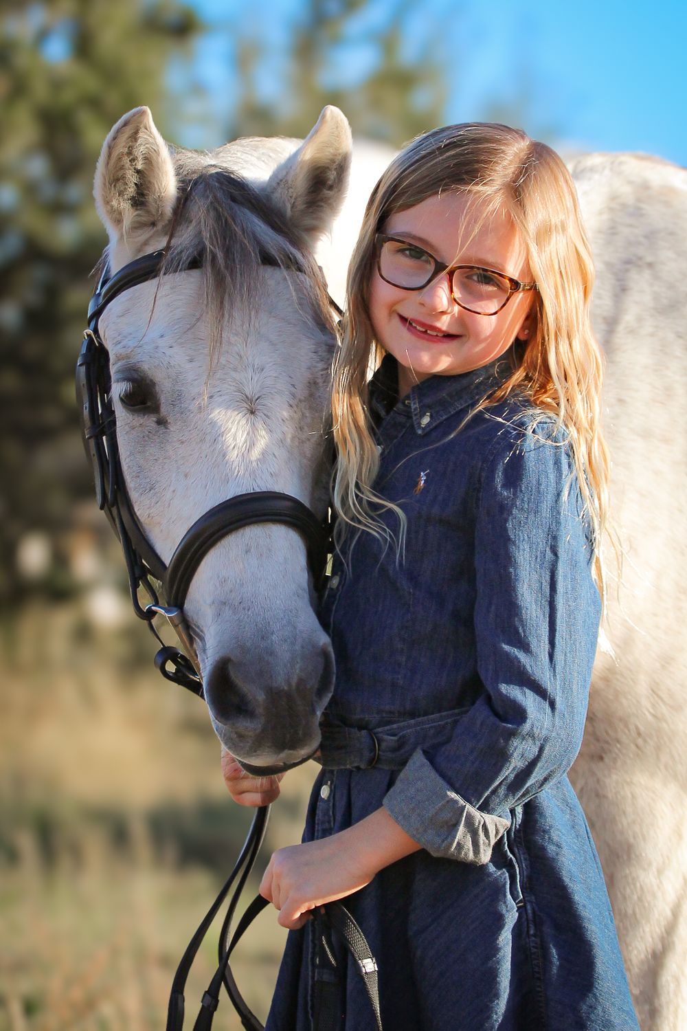 Pony and child photography Dripping Springs TX
Western horse and rider photo. Gray pony mare.
Equine lifestyle photos. Child with horse .