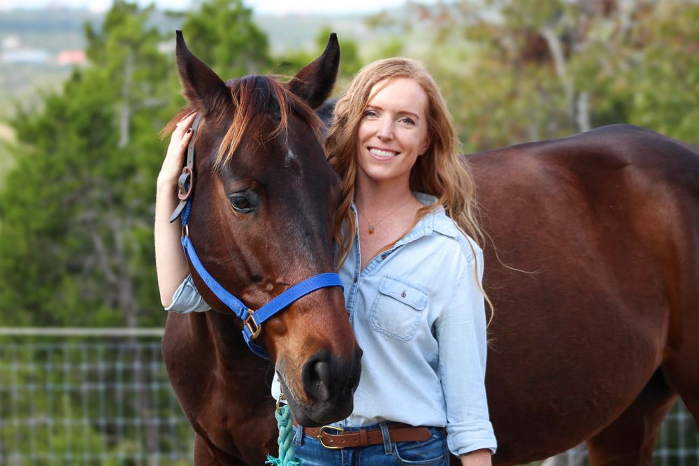 Woman with her gelding horse in an outdoor paddock in Wimberley, Texas. Equine photography shoot in Austin, Texas.