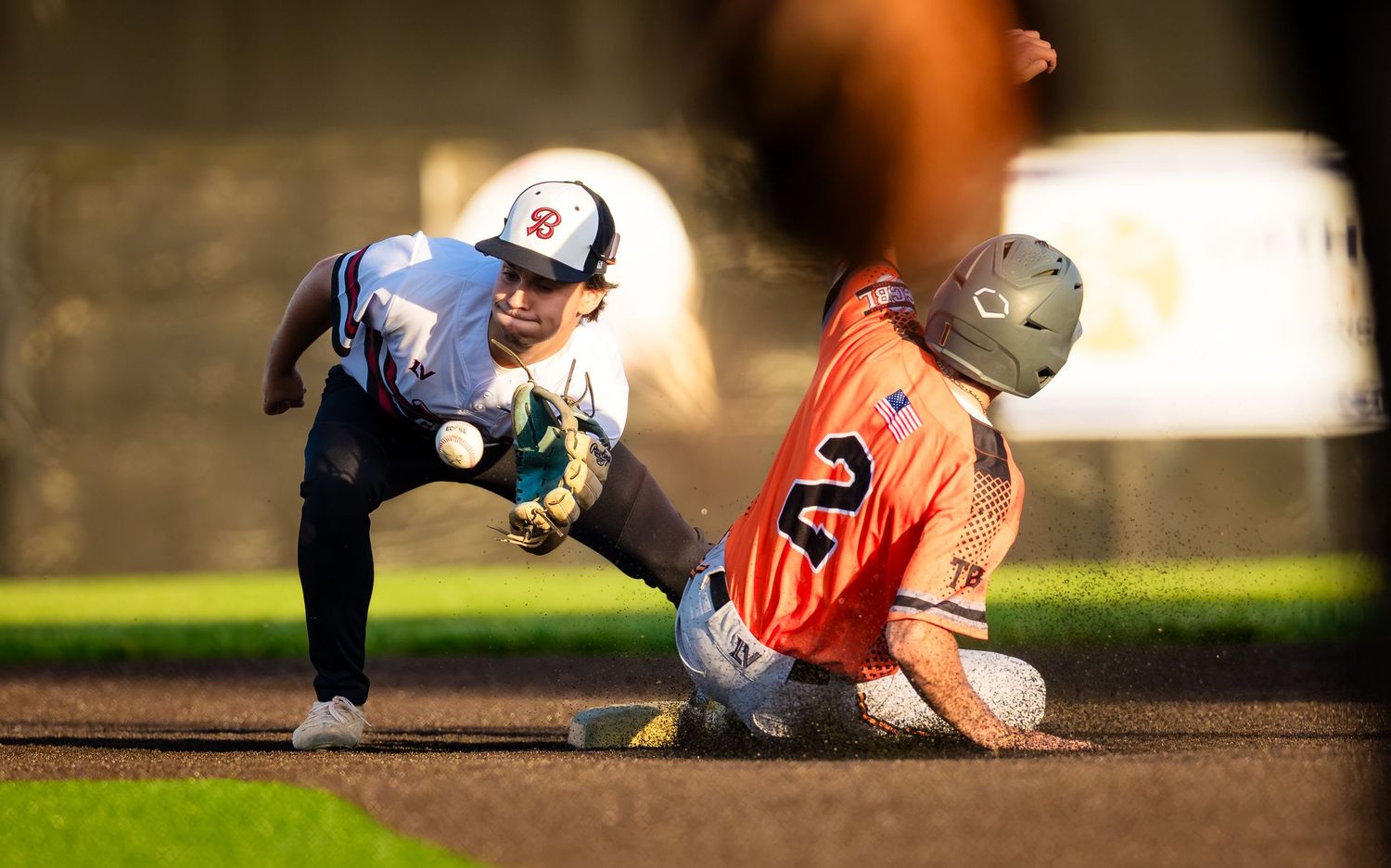 Central Penn Batmen fielder tags a sliding Quakertown runner at the base, by Deanna Fox, SportsFox Photography, Hershey PA