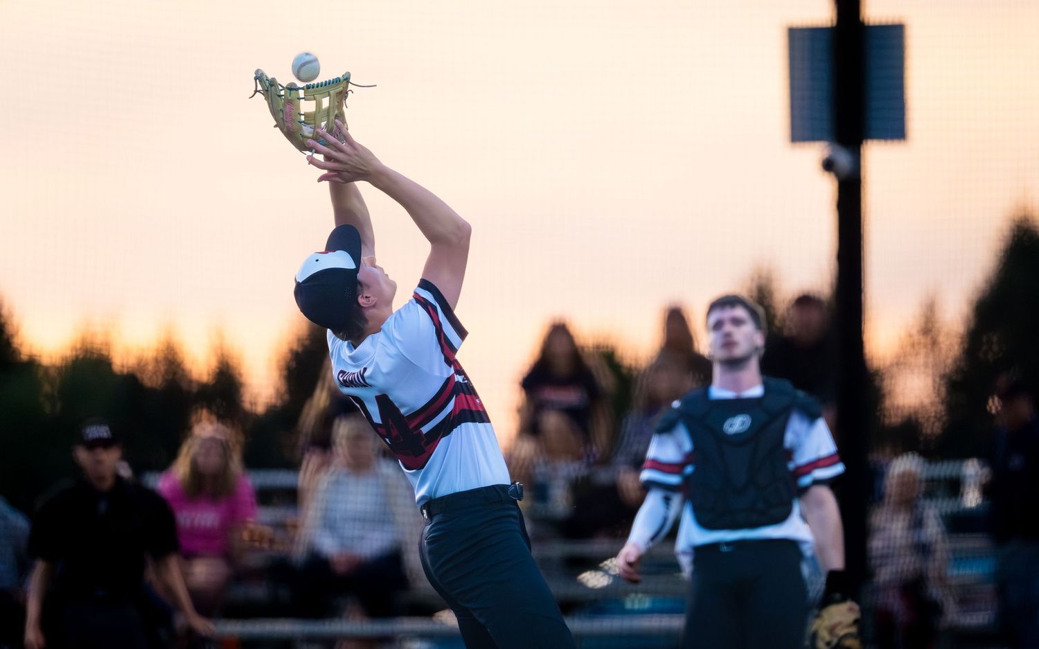 Central Penn Batmen player leaps for a catch against Quakertown, by Deanna Fox, SportsFox Photography, Hershey PA