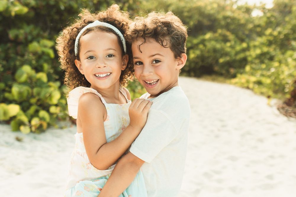 brother carrying his little sister