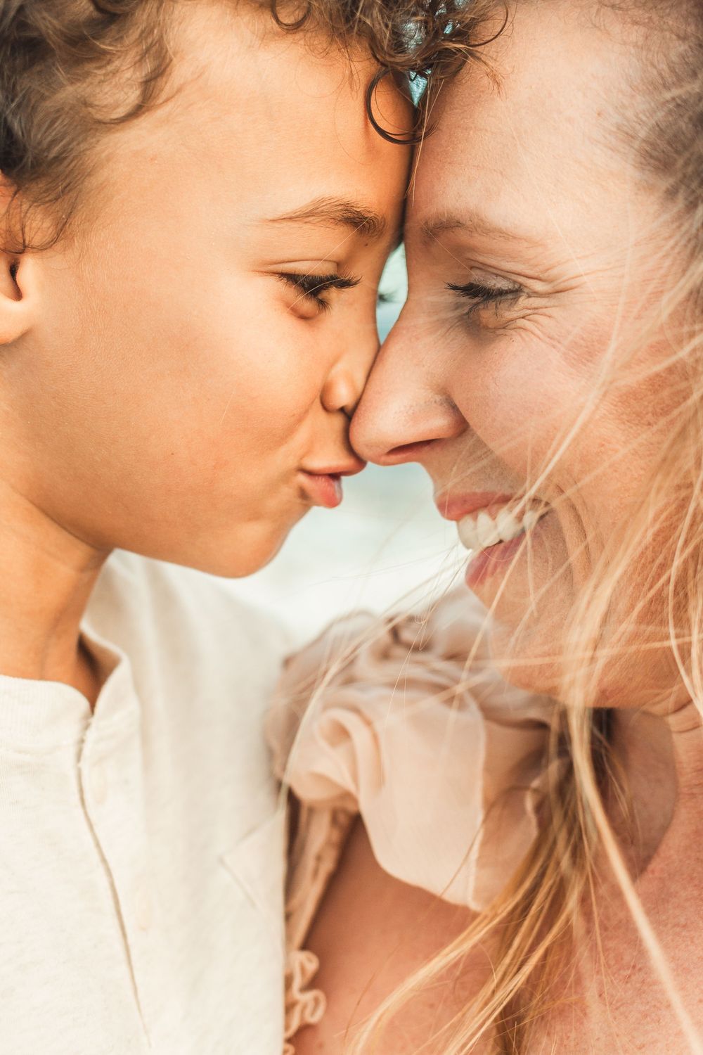 mother and son touching noses