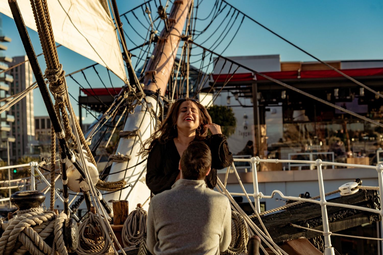 Zeus Holbrook San Diego Wedding Photographer
captures the moment of proposal on the deck of the Star of india