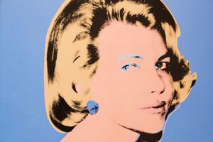 Andy Warhol pop art portrait of Grace Kelly in pink and gold tones on a blue background.