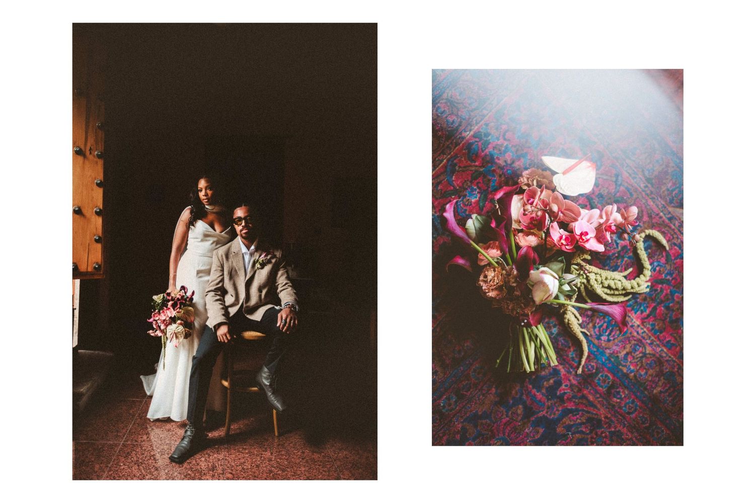 Couple posing in moody indoor light beside a vibrant floral bridal bouquet on patterned fabric.