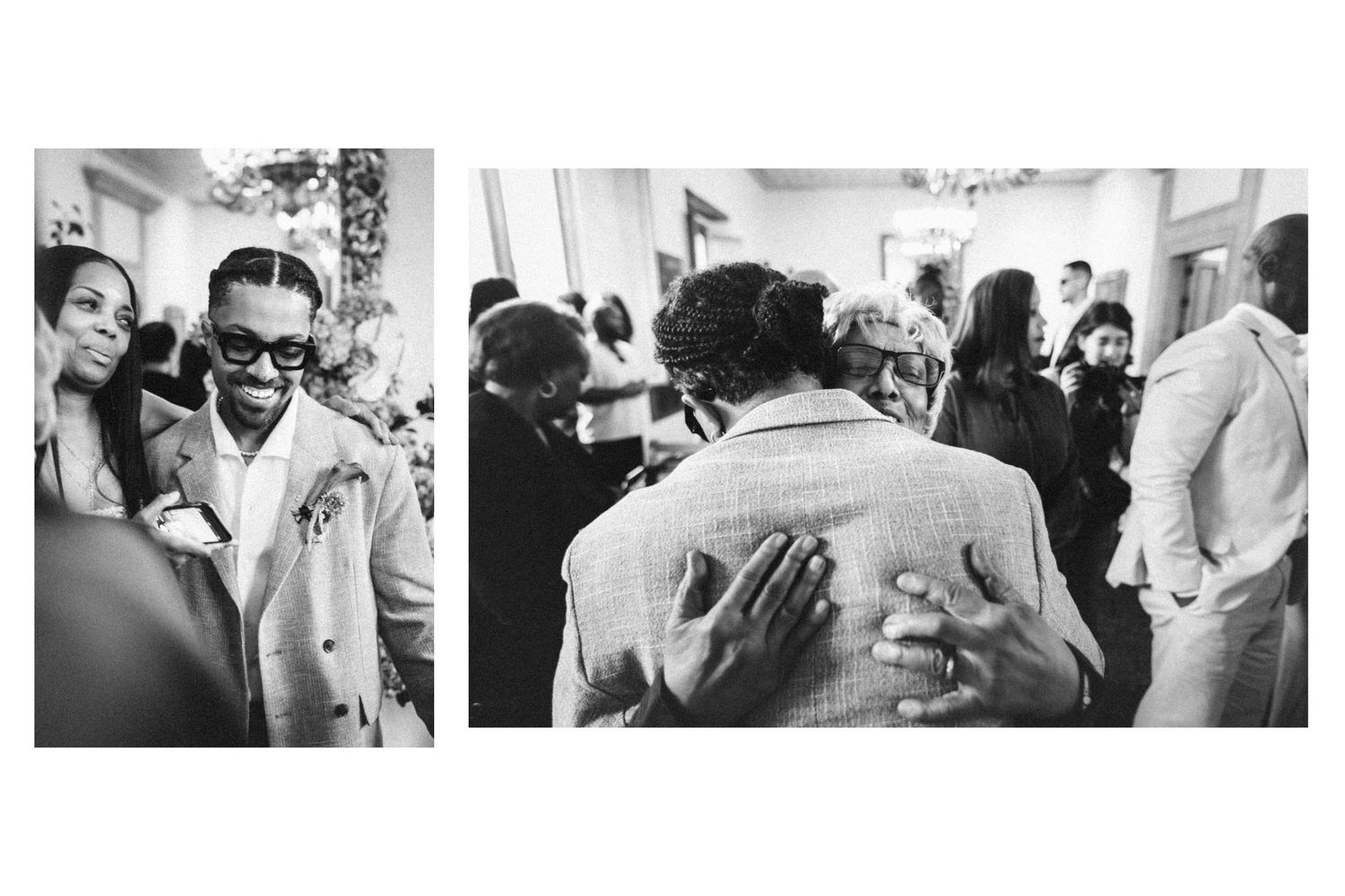 Black and white photo of guests smiling and embracing at an elegant social gathering or wedding reception.