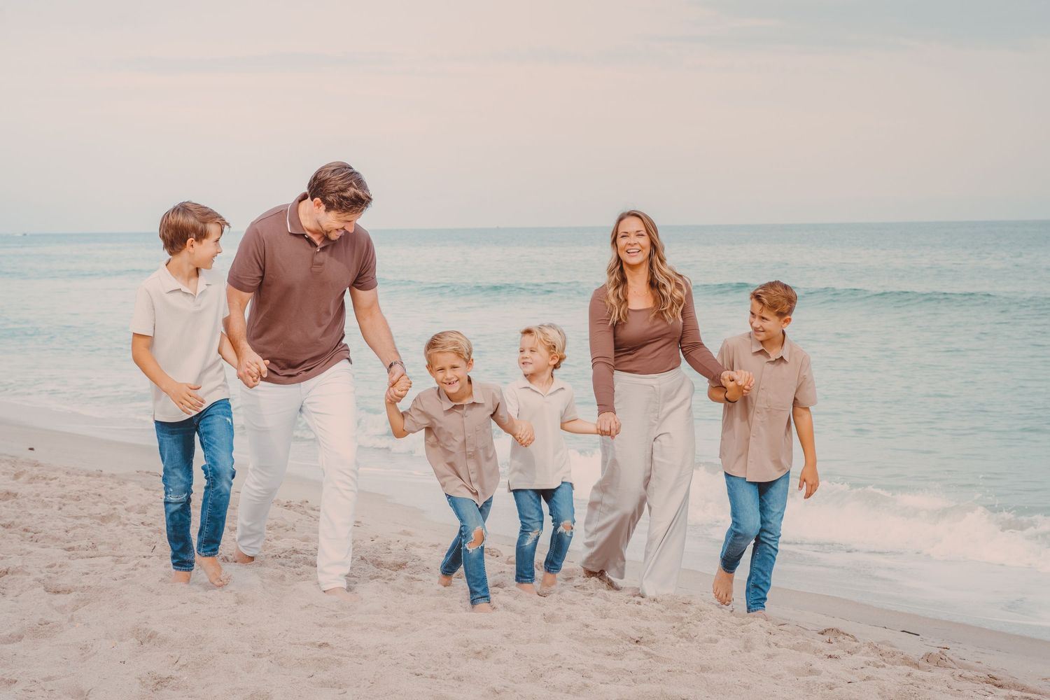Family pictures on a beach in Fort Pierce with a light and airy edit that captures joy.