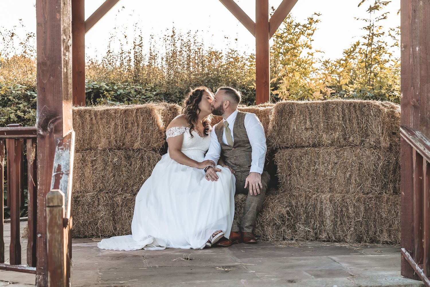 Outdoor wedding interactions in a countryside setting.