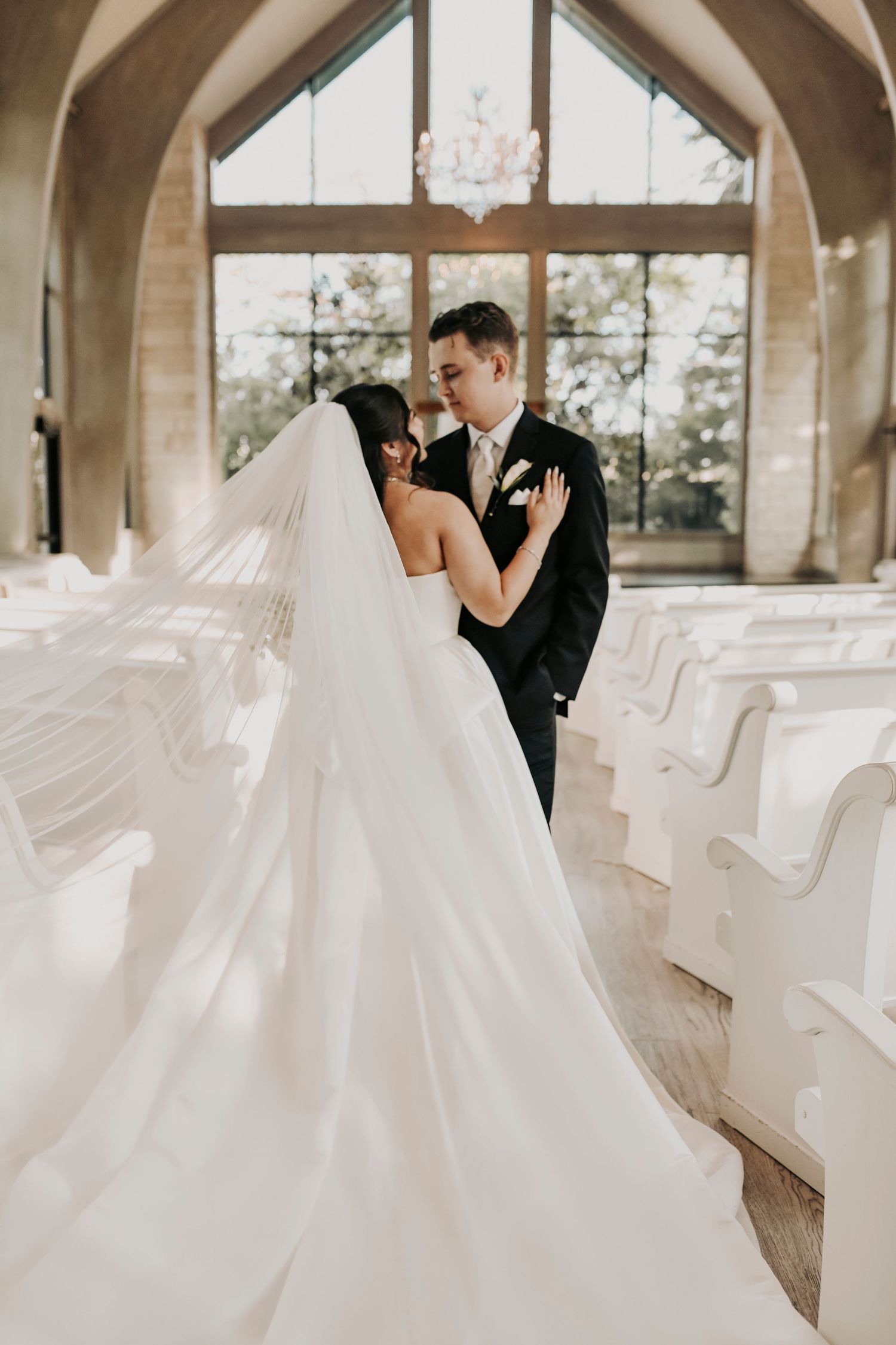 Romantic wedding portrait with white florals and greenery