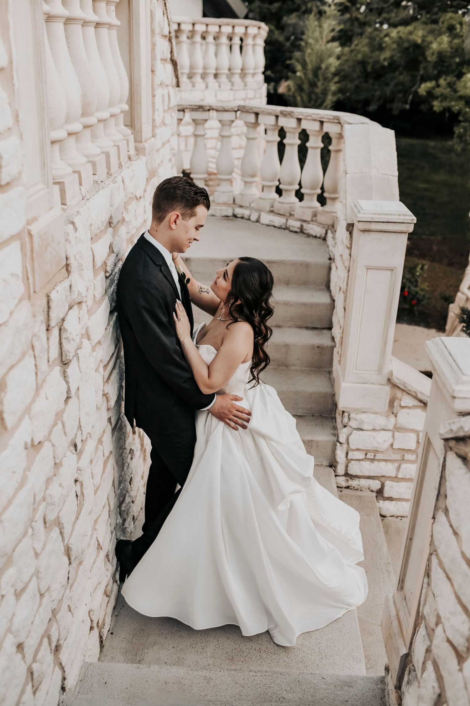 Romantic golden hour wedding portrait featuring a newly married couple