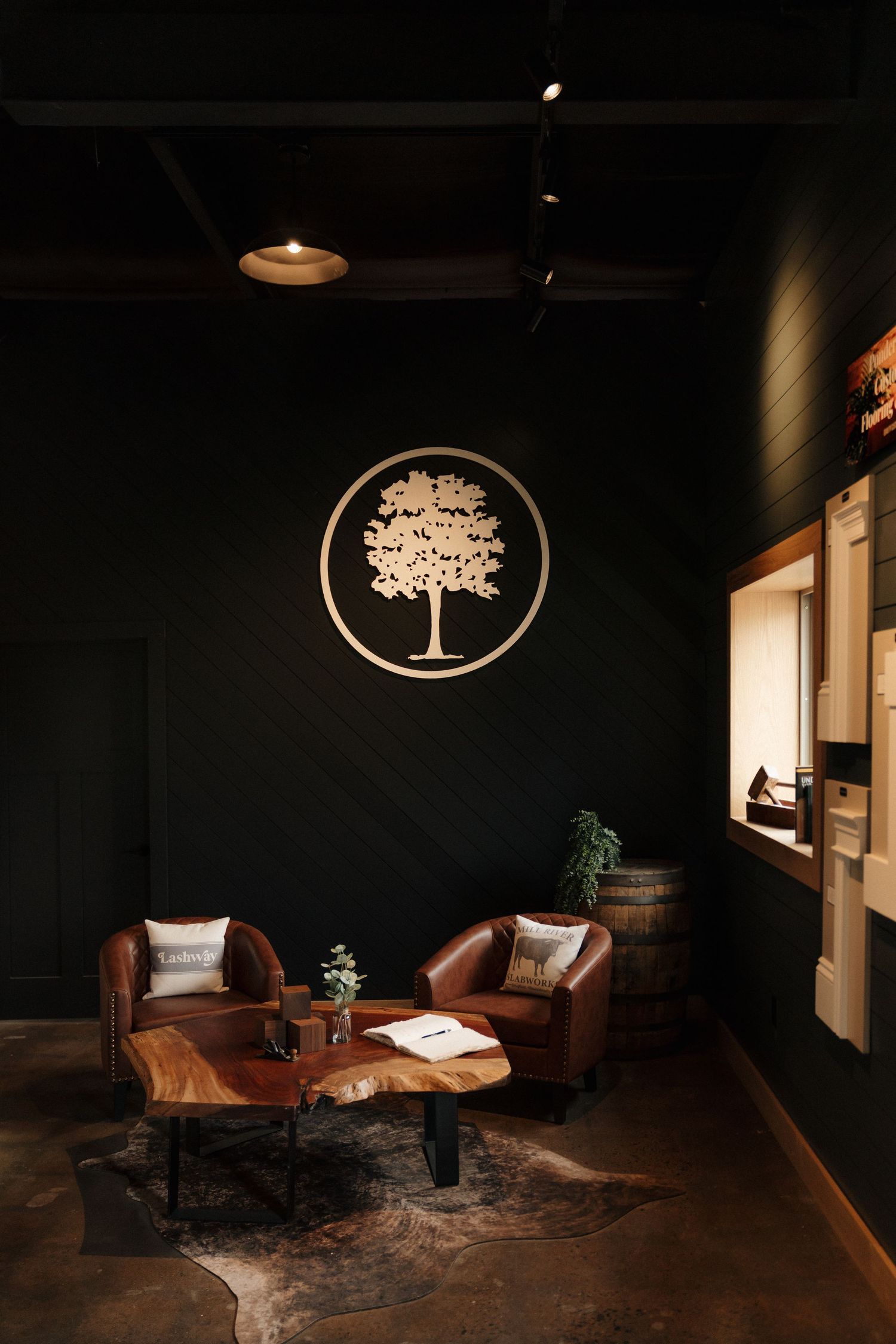 Interior scene with mural wallpaper, modern furniture and potted plants creating a serene atmosphere.