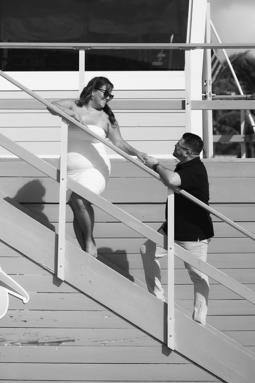 Couple posing in Pompano Beach during engagement couples session.