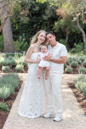 Family portrait in white with baby girl in Montecito