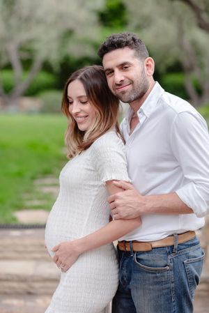 Montecito portrait of husband and pregnant wife in white
