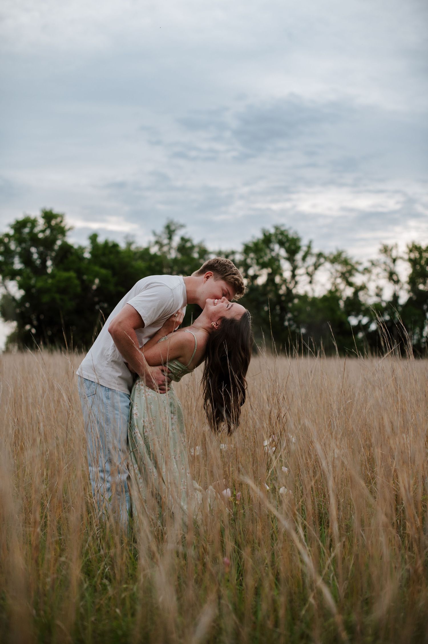 Wichita KS outdoor engagement photos in nature location Andover, couple photos in field with flowers, small elopement wedding photographer