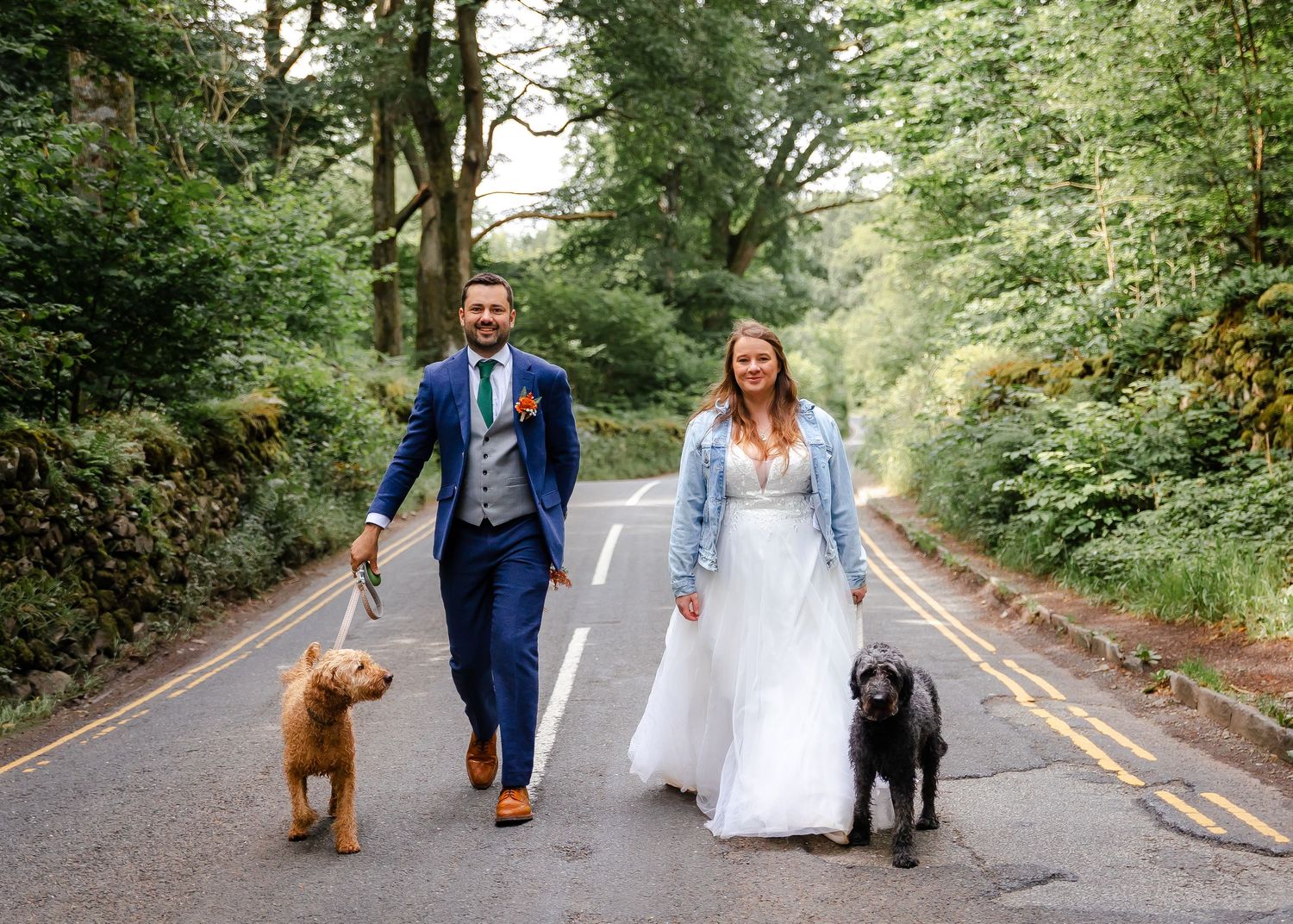 Cumbria wedding photographer - couple walking their dog in the lake