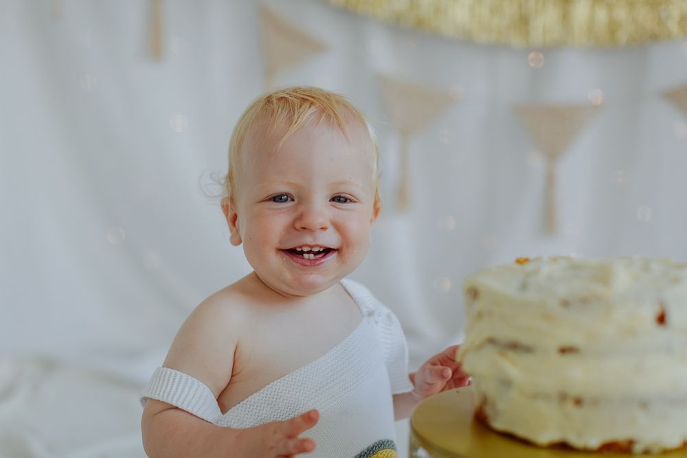 boy smiling during cake smash mini session sunshine coast