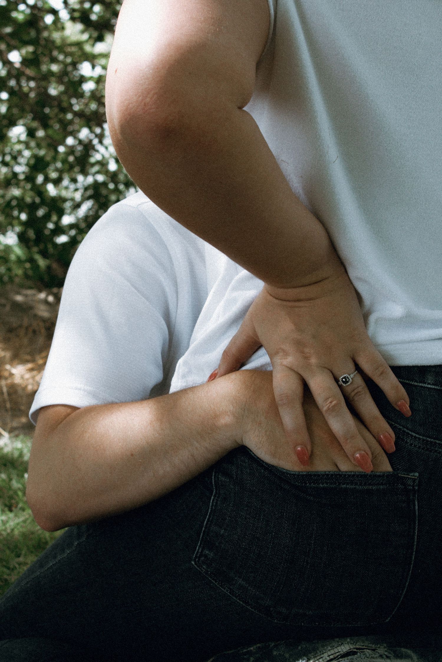 a couple showing off their engagement