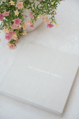 Beautiful linen album featuring family photos from Jagger Rose Photography in Hudson WI