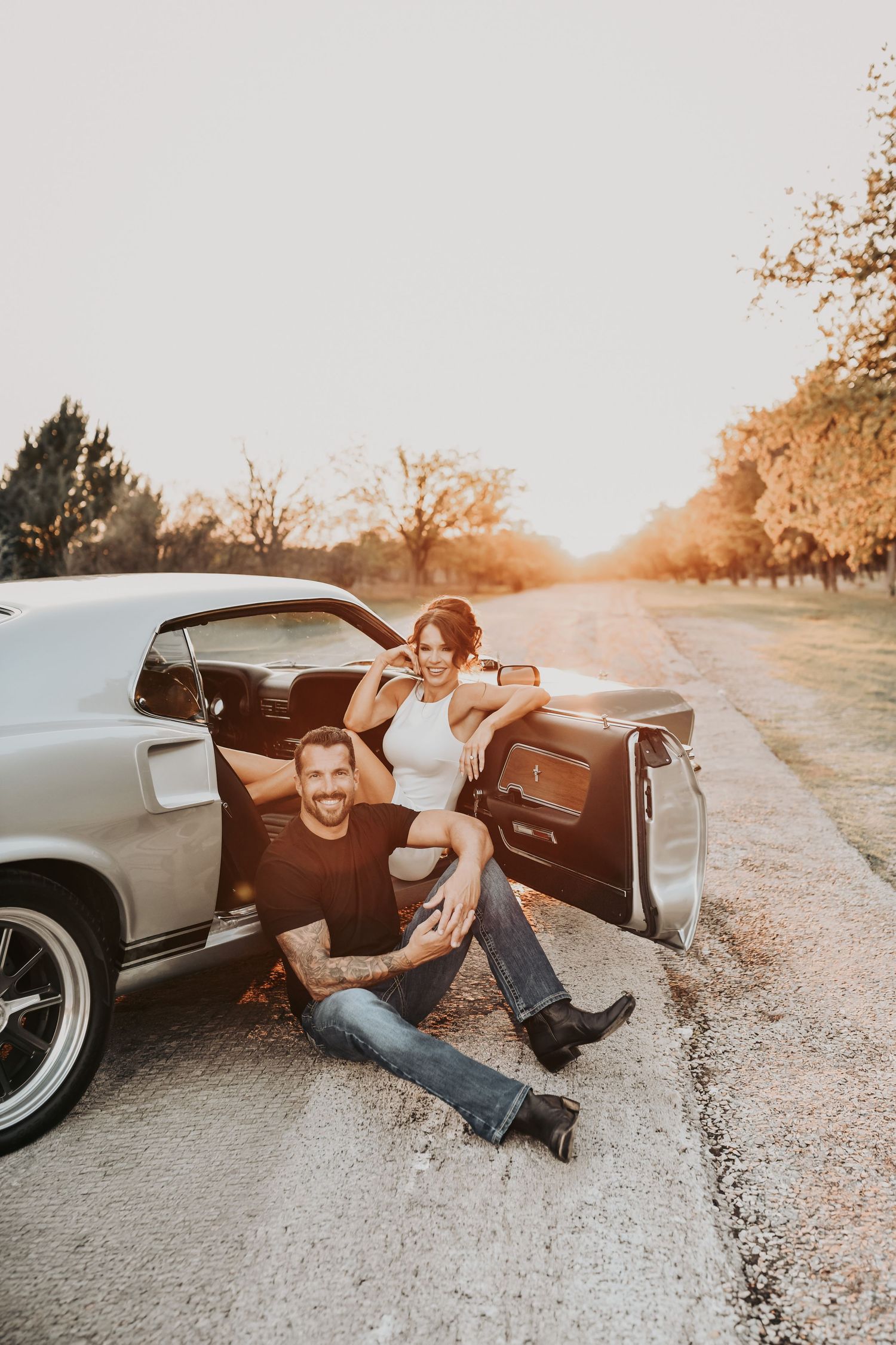 sunset silhouette couple engagement session with dramatic sky