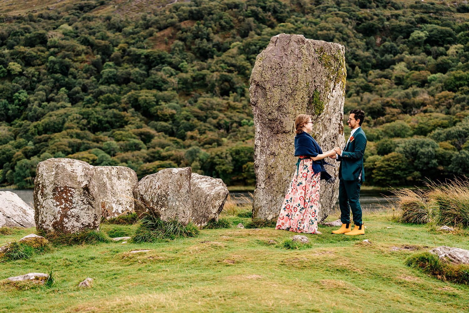 A series of scenic photos showing people relaxing and picnicking among ancient stone formations in a grassy meadow.
