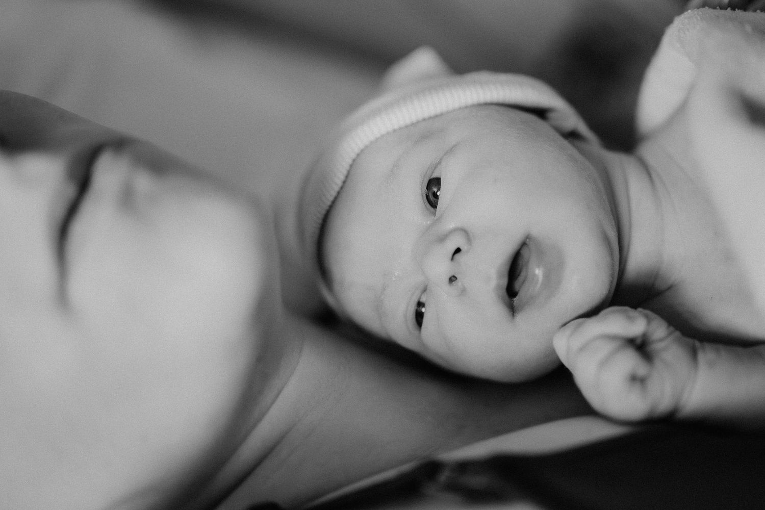 Black and white photograph showing intimate emotional expressions in an artistic portrait series.